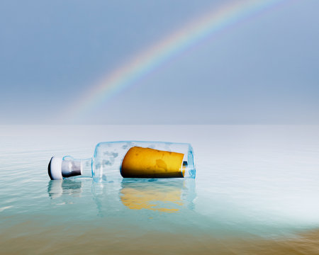 Message in a bottle in the water with a rainbow in the backgroundの写真素材
