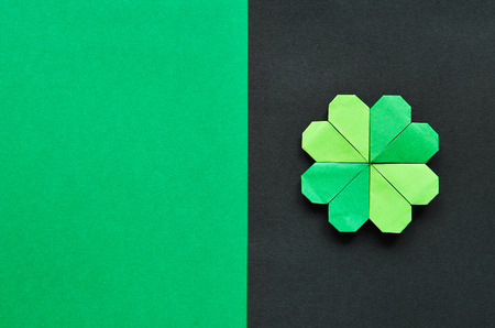 Green origami shamrock clover leaf paper background.の写真素材