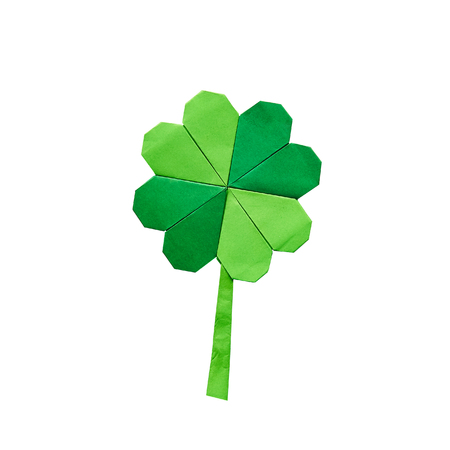 Green origami paper shamrock clover leaf on white background isolated.