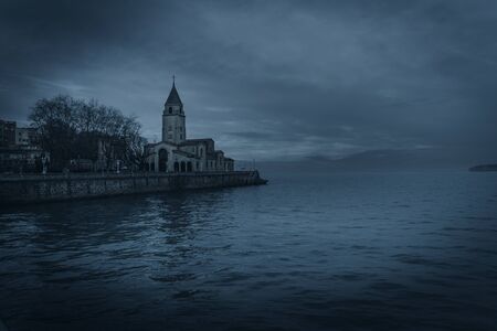 San Lorenzo beach with the church in the background in Gijon, Astutrias Spain