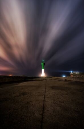 Lighthouse of San Juan, at the entrance of the Aviles estuary in Asturiasの写真素材