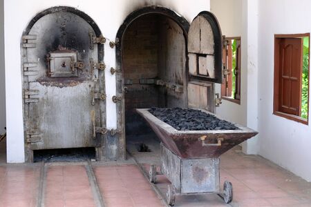 Sliding platform for placing coffins loaded with charcoal before being burned into the cremation roomの写真素材