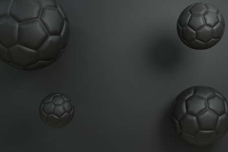 Dark color soccer or football balls levitate in the midair background with light and shadow 3D...