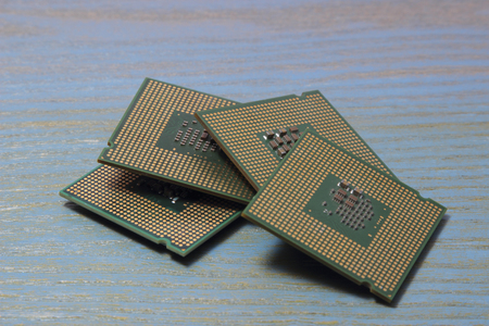 computer processor on a wooden background. cpu
