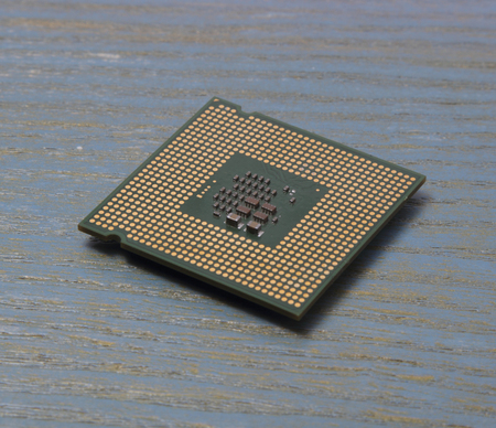 computer processor on a wooden background. cpu