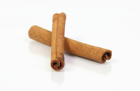 cinnamon stick spice isolated on white backgroundの写真素材