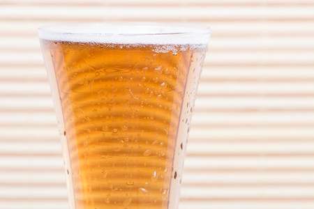 mug of light beer on a wooden background. alcohol