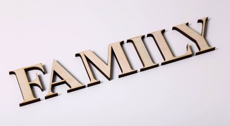 FAMILY wooden letters isolated on a white backgroundの写真素材