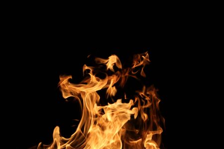 Wooden planks to the fire. The fire is lit in the night.の写真素材