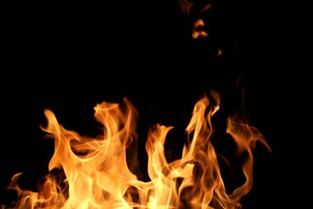 Wooden planks to the fire. The fire is lit in the night.