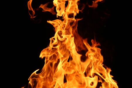 Wooden planks to the fire. The fire is lit in the night.