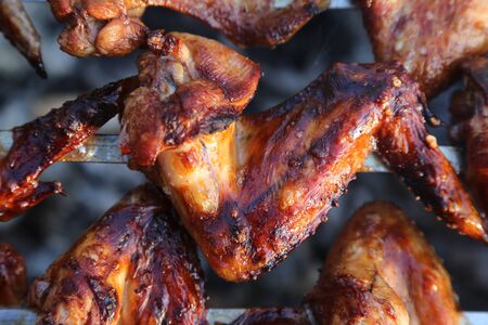 chicken wings on the grill barbecueの写真素材