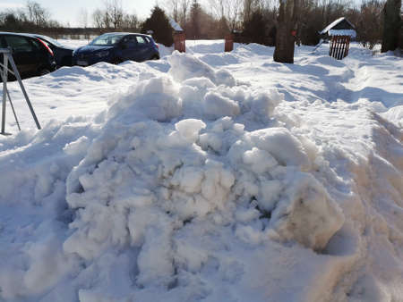 winter day in the Russian village snow well blue skyの写真素材