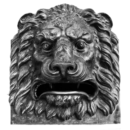 Havana / Cuba: The head of bronze lion stated on the wall of Local Post Office. Outdoors, close up, isolate, black and whiteの写真素材