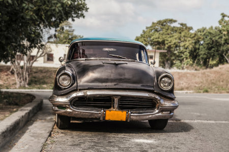 Old and rusty car Oldsmobile - Taxi in the surburb of Havana, Cuba. Front view, outdoor, close up.のeditorial素材