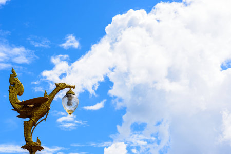 Thai Art Of Golden Swan Sculptures Light And Blue Sky Background.の写真素材