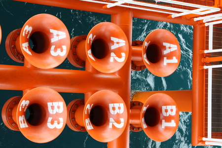 Oil and Gas Producing Slots at Offshore Platform, Oil and Gas Industry. Well head slot on the platform or rig. Production and Explorer industry.の写真素材
