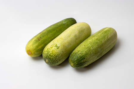 Fresh healthy three cucumbers on white backgroundの写真素材