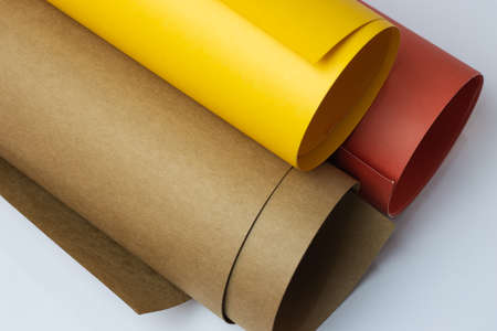 Colorful rolled textured art paper isolated on white background