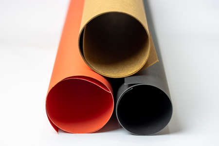 Rolled colorful textured art papers isolated on white backgroundの写真素材