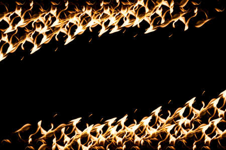 Fire frame with fire spark on black backgroundの写真素材