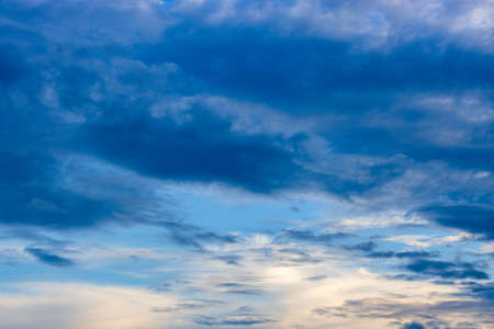 Blue cloudy sky before the eveningの写真素材