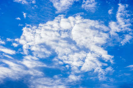 Blue sunny sky with moving white cloud