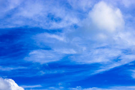 Rich blue sky with soft white cloudsの写真素材