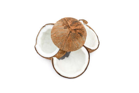 A pile of organic sliced coconuts on an isolated white background