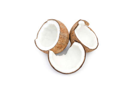 Close up view of organic sliced coconuts on an isolated white backgroundの写真素材