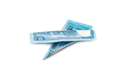 Two folded one hundred taka bangladesh banknotes on an isolated white background