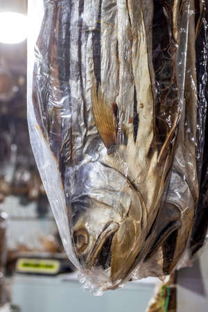 Close up view of a delicious dried big sea fish on a shop inside of a polybag