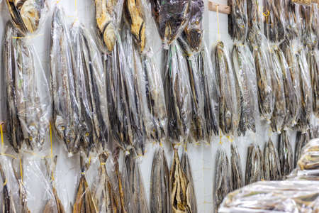 Dried sea fishes with various fish collections on a shop