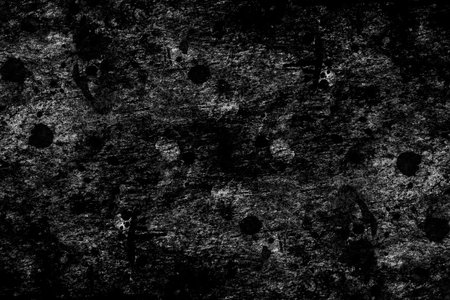 Black wood plank with dark grunge texture and spots for backgroundの写真素材