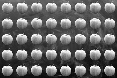 repeated seamless pattern of apple on black vintage billboardの写真素材
