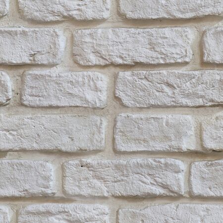 Seamless texture of old white brick with reliefの写真素材