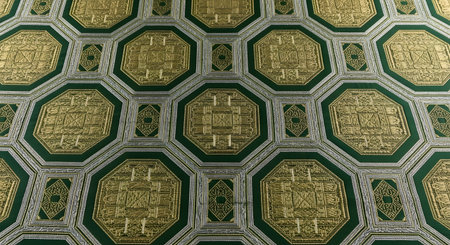 Elegant green gold fabric pattern. Intricate geometric design textile. Luxury upholstery material. Decorative surface.の素材