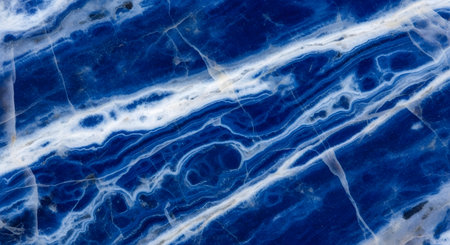 Deep blue sodalite stone surface mineral pattern; rough rock formation textureの素材