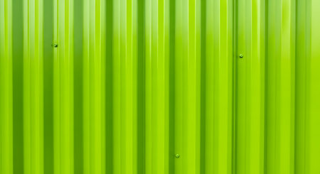 Lime green corrugated metal panel with vertical ridgesの素材