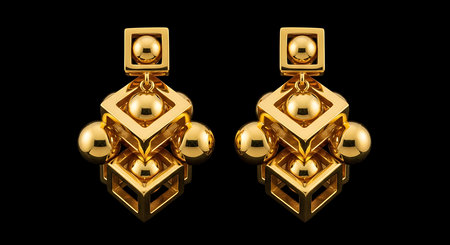 Gold geometric cube earrings. Luxury dangle jewelry. Modern abstract design. Bold statement adornment.の素材
