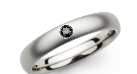 Modern matte silver ring, single black diamond, minimalist design, white backgroundの素材
