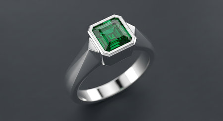Silver ring with emerald. Elegant jewelry. Luxurious gemstone accessory. Green stone.の素材