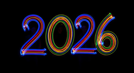 Light painting numbers 2026. Vibrant red, blue, green, yellow streaks. Pure black background. Dynamic glowing effect in darkness. Creative photography technique. Colorful light trails forming numbers. Abstract art with time element. Illuminating the future year. Energy and movement. Long exposure effect. Dark environment. Bright colors. Flowing light. Artistic display. Concept of time. New year. Abstract. Glowing lines. Light art. Dynamic visual.の素材