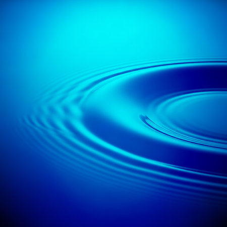 Dark blue water surface with ripples spreading out in concentric circles. Captivating water ripple effect for visual impact. Liquid texture for backdrop and graphic designの素材