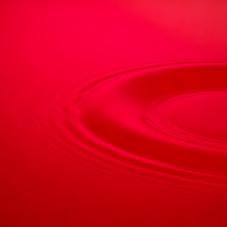 Enchanting water ripple effect forms peaceful concentric wave. Fluid surface demonstrates dynamic, liquid movement. Water surface in motion creates smooth ripples and pure, pristine texture.の素材