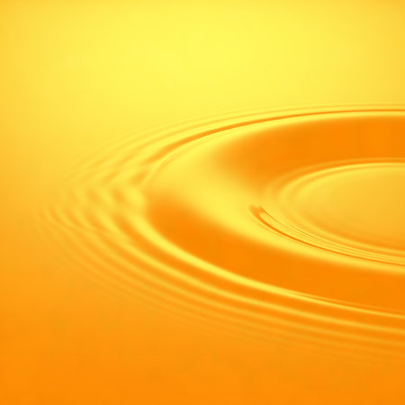 Shiny gold surface with ripple effect. Ideal for backdrops, posters and backgrounds. Vibrant liquid background with circular design. Modern and artistic background for design concept.の素材