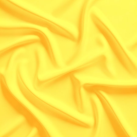Elegant smooth shiny yellow silk fabric folds texture. Luxury material background with drapery and soft pleats. Fashion design decor background. Smooth surface backdrop.の素材