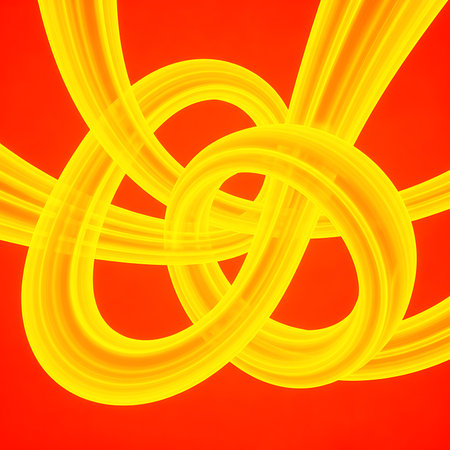 Abstract knot with intertwined yellow tubes on red backdrop creates modern graphic design. Vibrant color scheme makes eye catching background. Perfect for bold statements.の素材
