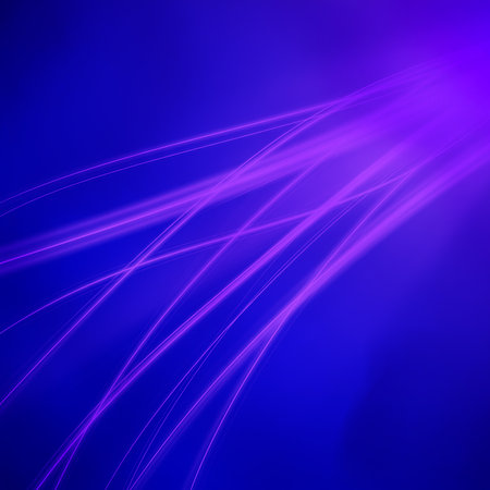 Smooth lighting illuminates vibrant blue background with diagonal luminous streaks.  Smooth texture creates modern abstract.  It's eye-catching display.の素材
