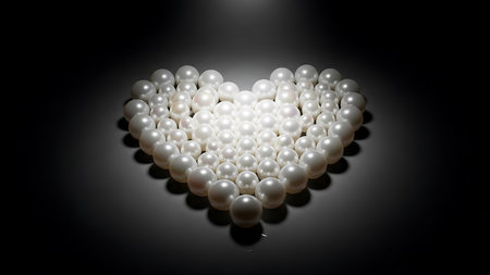 Luminous heart-shaped array of lustrous white pearls, elegant jewel collection on a dark surface, classic beauty and sophistication, perfect for luxury jewelry design or romantic giftの素材